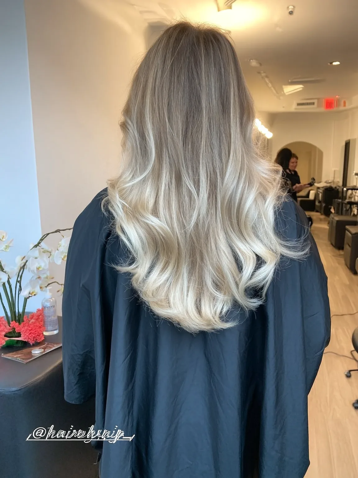 Voluminous Long Layers in Ash Blonde Balayage